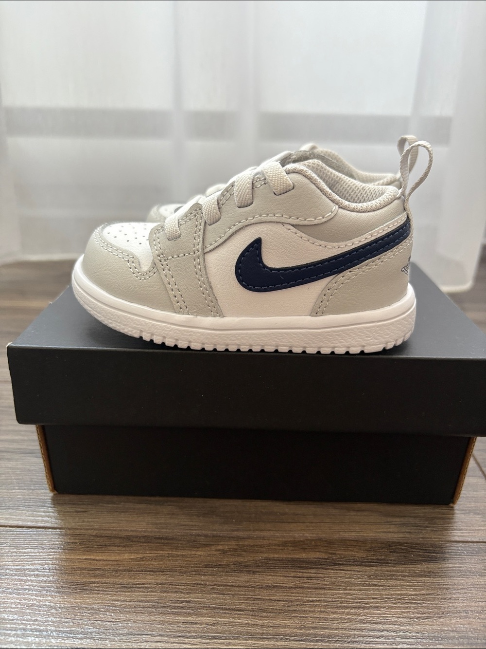 Nike Toddler White Sneaker with Navy Swoosh